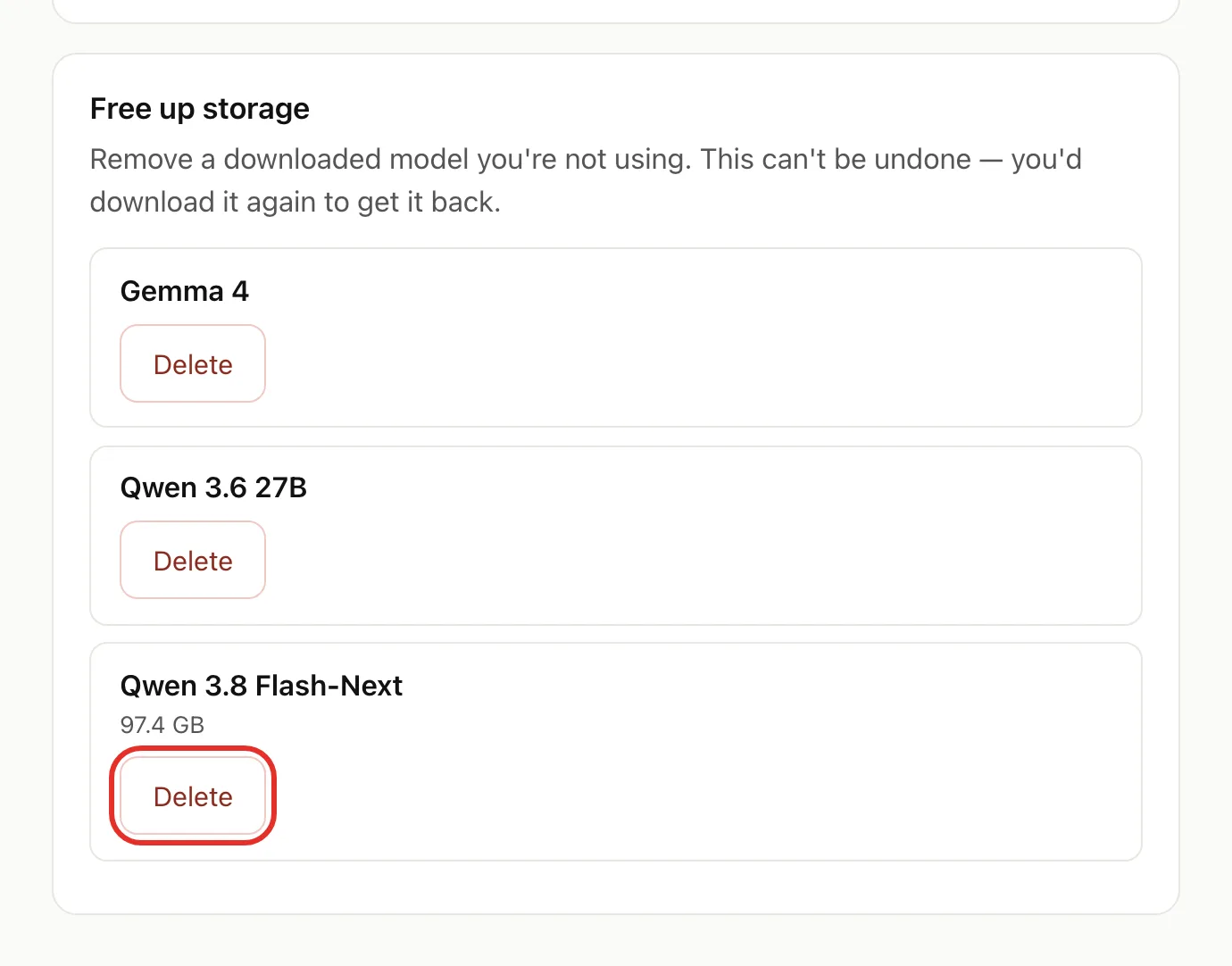 The Free up storage section listing Gemma 4, Qwen 3.6 27B and Qwen 3.8 Flash-Next (97.4 GB), with the Delete button for Qwen 3.8 Flash-Next circled