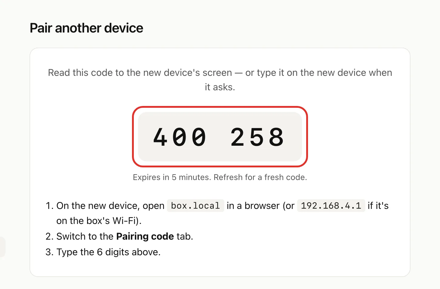 The Pair another device page with the 6-digit code circled